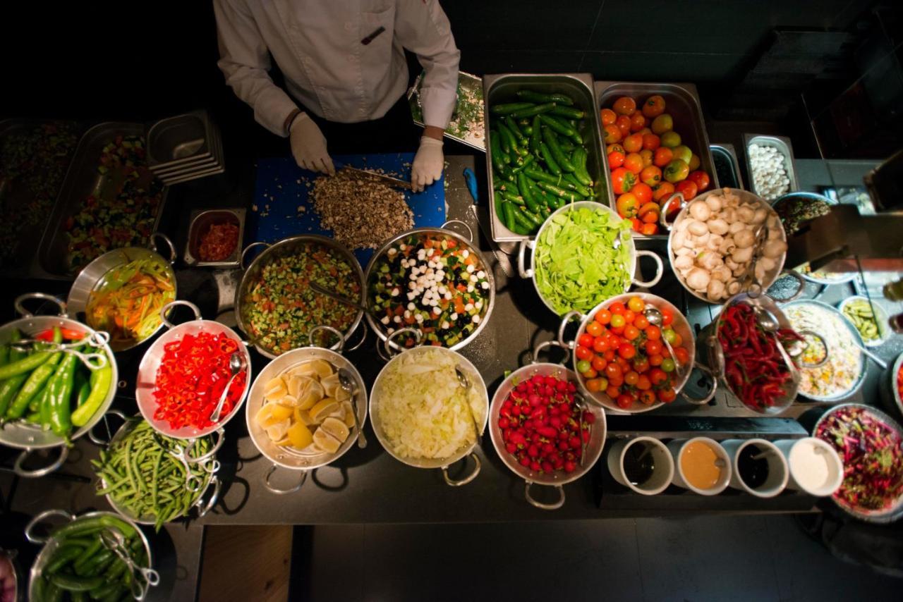 Cramim By Isrotel Exclusive Kiryat Anavim Exterior photo A chef preparing ingredients for a meal